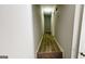 Hallway featuring modern vinyl flooring, leading to additional rooms in the home at 60 Sweet Bay Ln, Carrollton, GA 30116