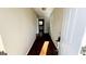 Hallway with vinyl flooring and neutral paint providing access to various rooms in the house at 60 Sweet Bay Ln, Carrollton, GA 30116