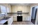Functional kitchen featuring wood cabinets, modern appliances, and plenty of counter space at 60 Sweet Bay Ln, Carrollton, GA 30116