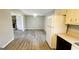 Open-concept kitchen and living room area with new floors and an airy atmosphere at 60 Sweet Bay Ln, Carrollton, GA 30116