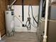 Utility area with flooring, water heater, and HVAC equipment at 60 Sweet Bay Ln, Carrollton, GA 30116