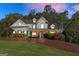 Charming two-story home with a welcoming front porch and beautiful landscaping at 4780 Rambling Rose Dr, Cumming, GA 30040