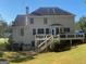 Spacious backyard with a deck, perfect for outdoor dining and relaxation at 4780 Rambling Rose Dr, Cumming, GA 30040