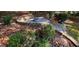 Beautiful backyard area with lush shrubs, stone stairs, and a quaint fire pit at 4780 Rambling Rose Dr, Cumming, GA 30040