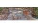 Charming backyard fire pit with stone trim and a stone surround to enjoy outdoor living at 4780 Rambling Rose Dr, Cumming, GA 30040
