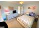 Cozy bedroom with light blue walls, a ceiling fan, and a closet at 4780 Rambling Rose Dr, Cumming, GA 30040