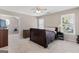 Comfortable bedroom with a ceiling fan, closet, and natural light at 4780 Rambling Rose Dr, Cumming, GA 30040