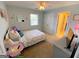 Cozy bedroom with light blue walls, a ceiling fan, and a closet at 4780 Rambling Rose Dr, Cumming, GA 30040