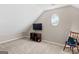 Bonus room with vaulted ceiling, oval window, and carpet flooring at 4780 Rambling Rose Dr, Cumming, GA 30040