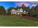 Beautiful two-story home with a manicured front lawn, perfect for entertaining at 4780 Rambling Rose Dr, Cumming, GA 30040
