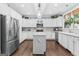 Charming kitchen featuring white cabinets, stainless steel appliances, and center island at 4780 Rambling Rose Dr, Cumming, GA 30040