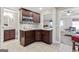 Kitchenette area features cabinetry, sink, microwave, and access to bathroom at 4780 Rambling Rose Dr, Cumming, GA 30040