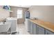 Bright laundry room with modern appliances, sink, folding counter, and storage at 4780 Rambling Rose Dr, Cumming, GA 30040