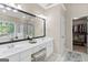 Bright bathroom features double sink vanity, soaking tub, and glass shower at 4780 Rambling Rose Dr, Cumming, GA 30040