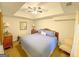 Main bedroom with carpet floor, ceiling fan, and a large bed at 4780 Rambling Rose Dr, Cumming, GA 30040