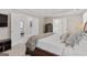 Large main bedroom with sitting area and views of the en suite bathroom and bedroom at 4780 Rambling Rose Dr, Cumming, GA 30040