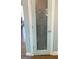 Pantry door with frosted glass in a well-lit and modern kitchen at 4780 Rambling Rose Dr, Cumming, GA 30040