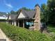 Community pool house with stone chimney with a clear view of the refreshing pool at 4780 Rambling Rose Dr, Cumming, GA 30040