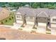 Three townhomes viewed from above, showcasing the community layout at 4121 Fulson Dr, Lilburn, GA 30047