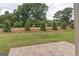 Landscaped backyard with a view of trees and road at 4121 Fulson Dr, Lilburn, GA 30047
