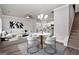 Open dining room with hardwood floors and modern chandelier at 4121 Fulson Dr, Lilburn, GA 30047