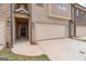 Front view of townhome with covered entry and attached garage at 4121 Fulson Dr, Lilburn, GA 30047