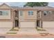 Two story townhome with attached garage and neutral color brick exterior at 4121 Fulson Dr, Lilburn, GA 30047