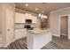 Modern kitchen with island, stainless steel appliances, and white cabinets at 4121 Fulson Dr, Lilburn, GA 30047