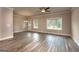 Spacious living room with hardwood floors and large windows at 4121 Fulson Dr, Lilburn, GA 30047