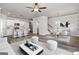 Open concept living room and kitchen with hardwood floors at 4121 Fulson Dr, Lilburn, GA 30047