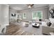 Open living room with sectional sofa and hardwood floors at 4121 Fulson Dr, Lilburn, GA 30047