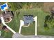 Overhead view of a beautiful home with a manicured lawn and concrete driveway at 253 Edenwylde Ct, Hampton, GA 30228