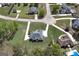 Aerial shot of a well-manicured property with circular driveway in residential neighborhood at 253 Edenwylde Ct, Hampton, GA 30228
