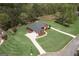 Expansive aerial view of the property highlighting its large lot, lush landscaping, and serene setting at 253 Edenwylde Ct, Hampton, GA 30228