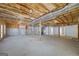 Spacious unfinished basement featuring high ceilings and natural light, ready for personalized finishing and improvements at 253 Edenwylde Ct, Hampton, GA 30228