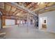 Unfinished basement with high ceilings offers potential for customization and additional living space with garage access at 253 Edenwylde Ct, Hampton, GA 30228
