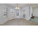 Bright breakfast nook featuring multiple windows and view to the brick fireplace at 253 Edenwylde Ct, Hampton, GA 30228