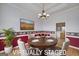 Virtually staged dining room with elegant furnishings, decorative accents, and a bright, inviting atmosphere at 253 Edenwylde Ct, Hampton, GA 30228