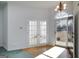 Bright entryway featuring hardwood floors and elegant French doors, creating a welcoming ambiance at 253 Edenwylde Ct, Hampton, GA 30228