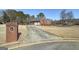 Brick house with driveway and landscaped yard at 253 Edenwylde Ct, Hampton, GA 30228