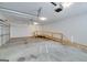Spacious garage featuring a wheelchair ramp leading to a side door and overhead lighting at 253 Edenwylde Ct, Hampton, GA 30228