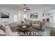 Virtually staged living room featuring neutral furniture, stylish decor, and ample space for entertaining at 253 Edenwylde Ct, Hampton, GA 30228