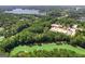 Aerial view of buildings and golf course near lake at 205 Stonehaven Dr, Fayetteville, GA 30215