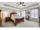 Spacious bedroom with a ceiling fan, large windows, and ample closet space at 205 Stonehaven Dr, Fayetteville, GA 30215