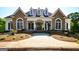 Inviting stone and shingle home with a grand entrance at 205 Stonehaven Dr, Fayetteville, GA 30215