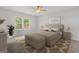 Inviting bedroom showcasing a queen-sized bed, soft lighting, and a serene atmosphere at 214 Kindness Cir, Mcdonough, GA 30252