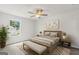 Comfortable bedroom with neutral tones, featuring a queen-sized bed and natural light at 214 Kindness Cir, Mcdonough, GA 30252
