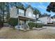 Two-story house with gray siding, blue garage door, and landscaping at 5735 Old Carriage Dr, South Fulton, GA 30349