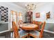 Charming dining area with wood table and chairs at 8712 Spivey Village Trl, Jonesboro, GA 30236