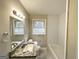 Clean bathroom with granite vanity and subway tile at 1271 Avonwood Sw Cir, Atlanta, GA 30311